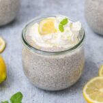 A jar of chia seed pudding surrounded by lemons.