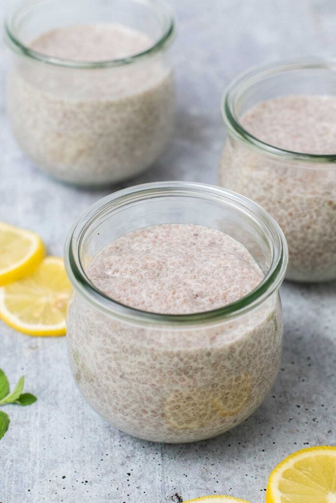 3 jars filled with a thickened lemon chia pudding.
