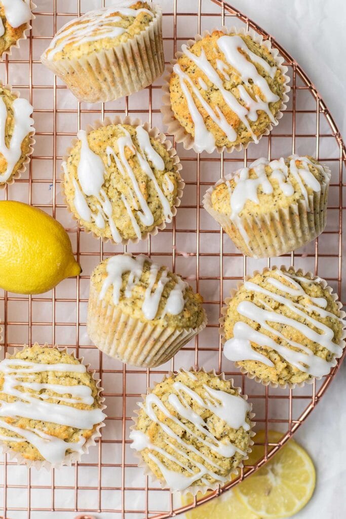 Keto lemon poppyseed muffins on a baking rack.