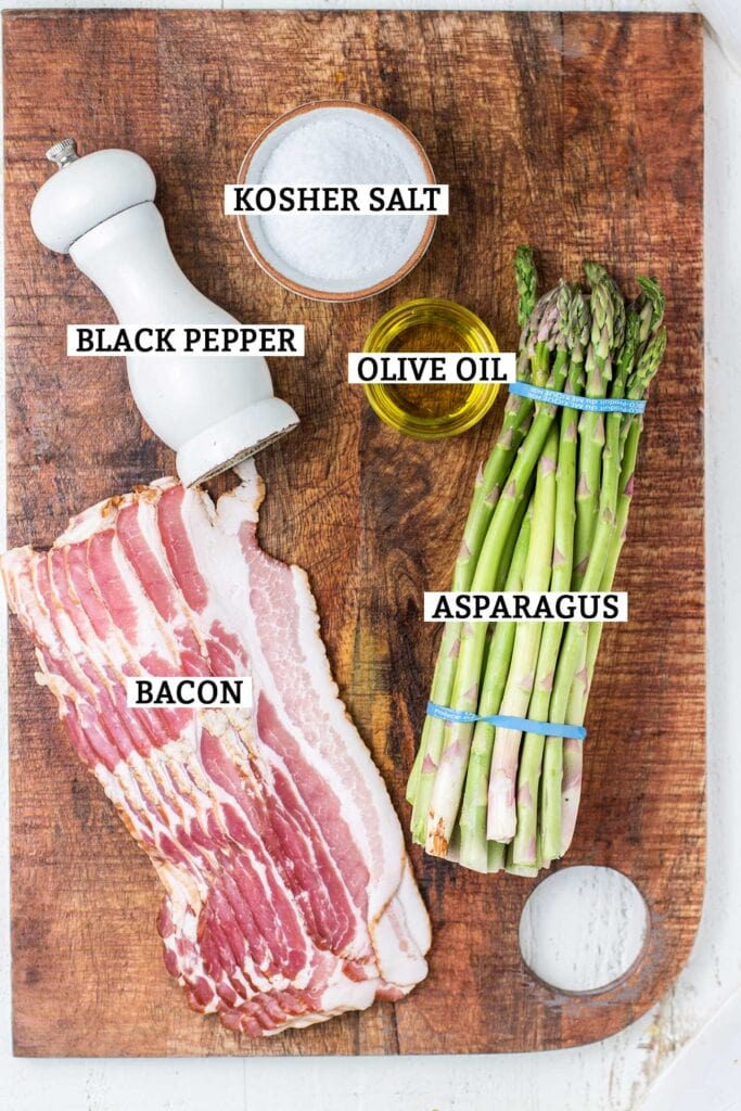 The ingredients needed to make air fryer bacon wrapped asparagus.