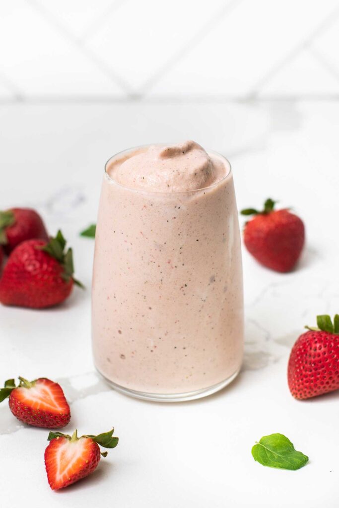 A thick and creamy smoothie made with zucchini and strawberries.