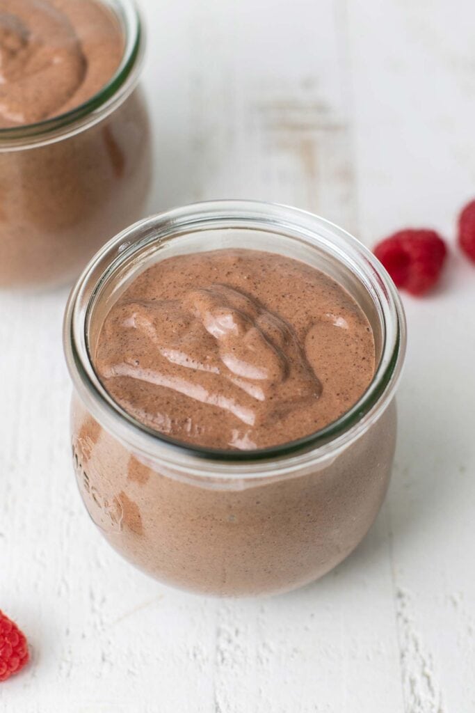 A jar with a silky blended chocolate chia pudding.