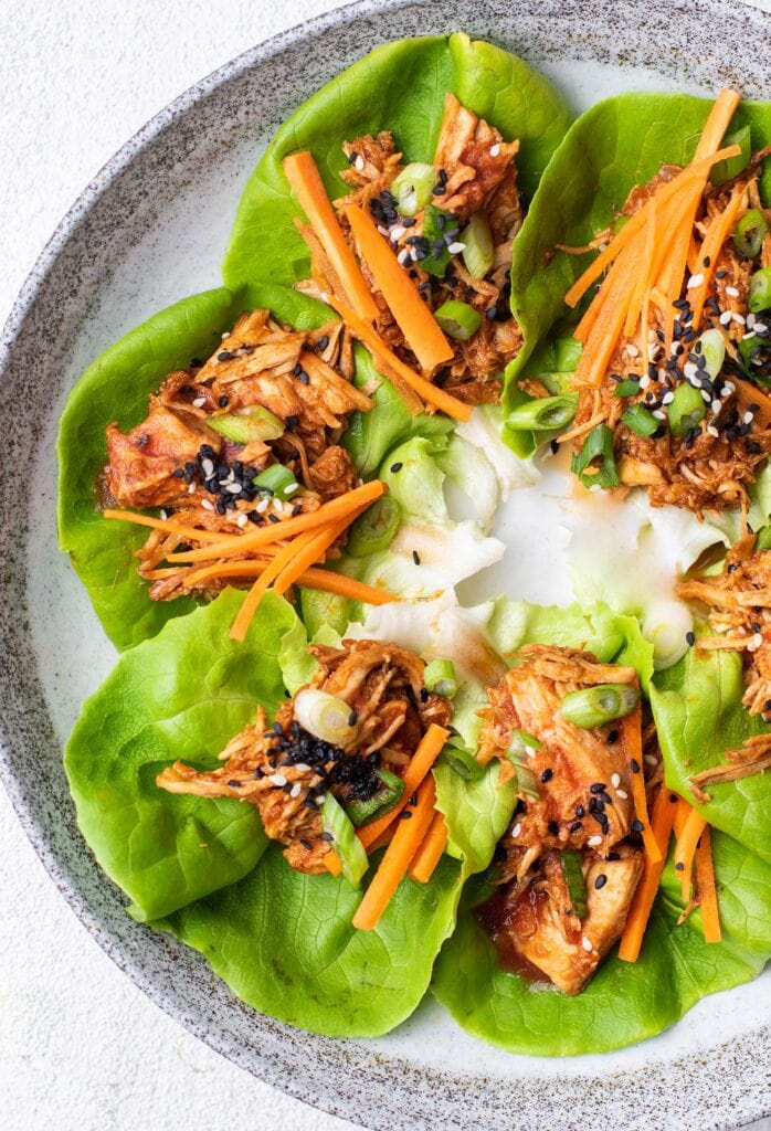 A plate of Asian chicken lettuce wraps.