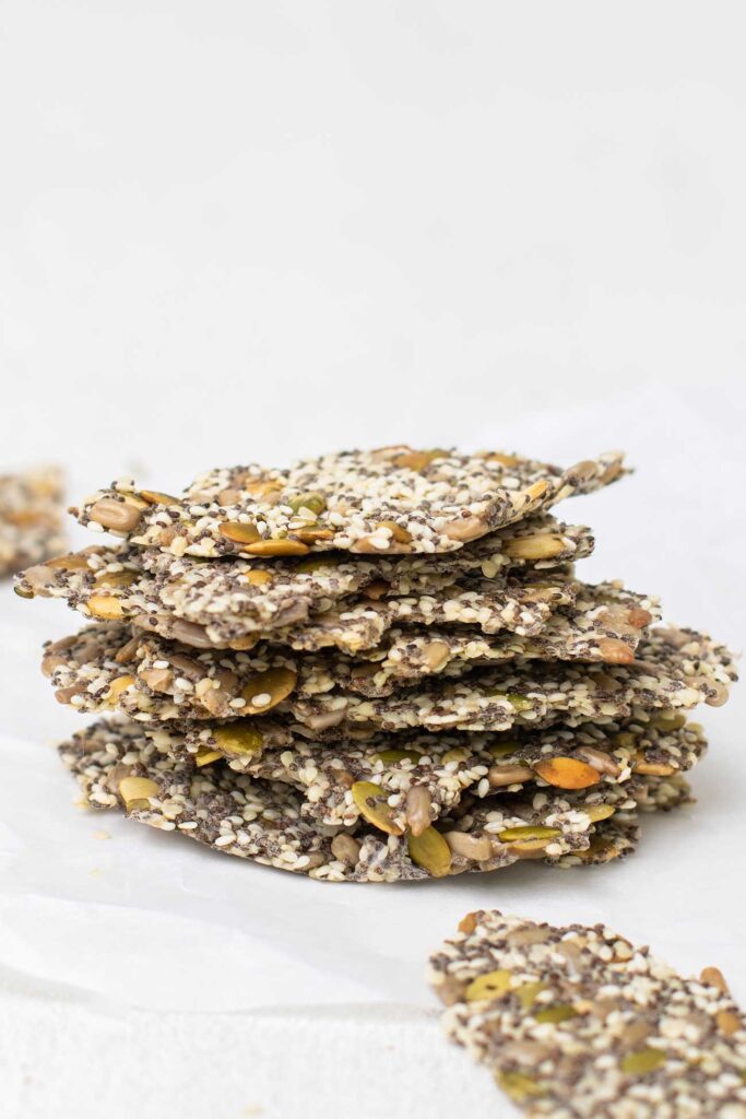 A stack of Chia Seed Crackers showing the variety of seeds.