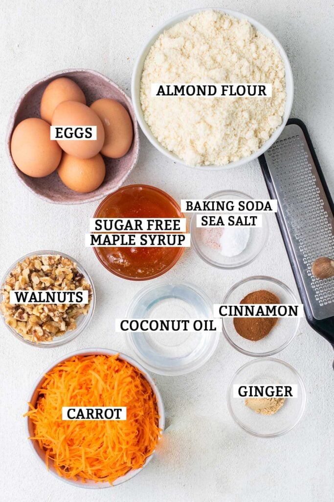 The ingredients needed to make a keto carrot cake shown with labels.