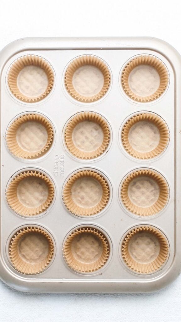 A muffin tin with cupcake liners.
