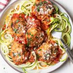 A plate of zoodles and keto chicken meatballs.