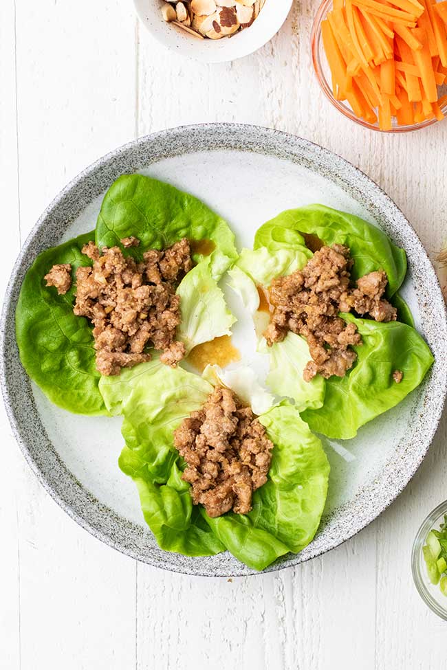 Add the minced pork to lettuce cups.