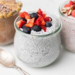 High Protein Chia Seed Pudding shown in jars with berries and nuts.