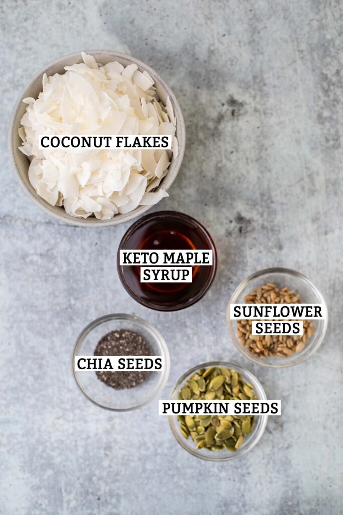 The ingredients needed for Keto Coconut Clusters shown with labels.