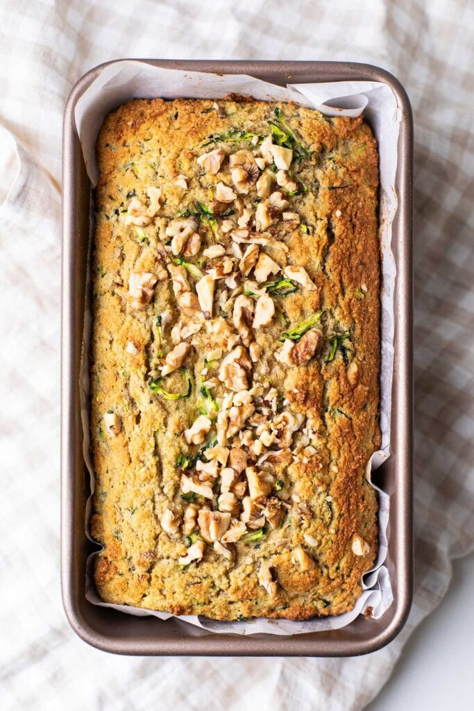 A baked, browned loaf of low carb zucchini bread.